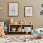 stylish scandinavian kid room interior with toys, teddy bear, pl